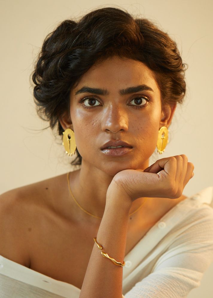 A Model Wearing Gold  Gold Plated Brass Chaand Ear Studs, curated by Only Ethikal