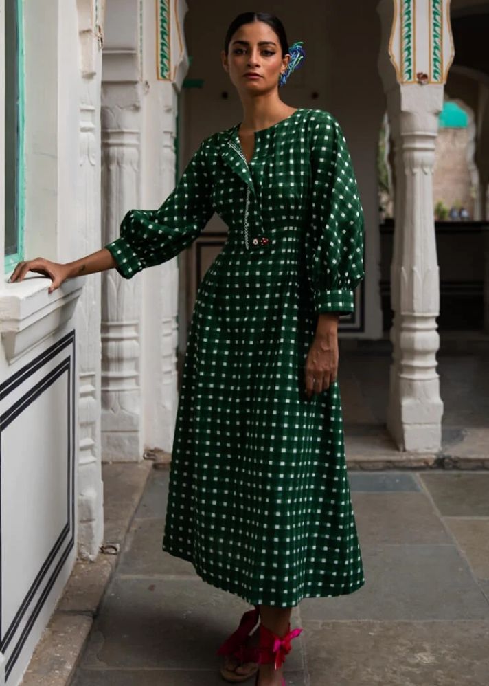 A Model Wearing Green Handloom cotton Bari Midi Dress, curated by Only Ethikal