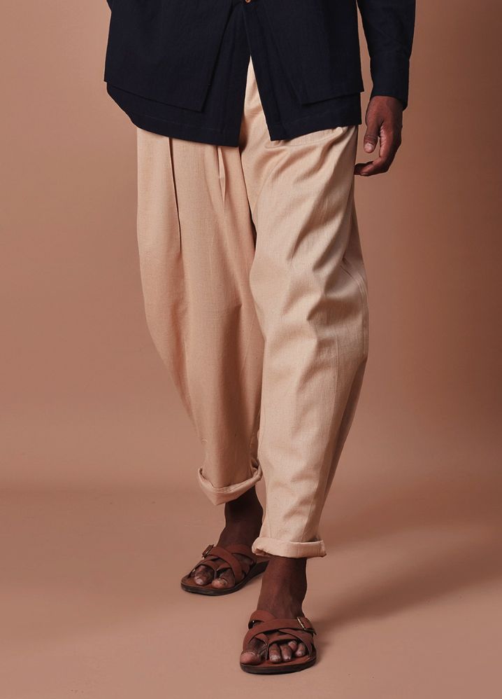 A Model Wearing  Beige Pure Cotton Men's Beige Pleated Balloon Pants, curated by Only Ethikal