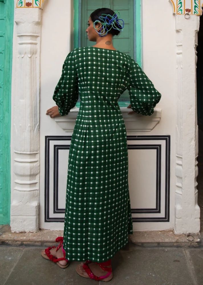 A Model Wearing Green Handloom cotton Bari Midi Dress, curated by Only Ethikal