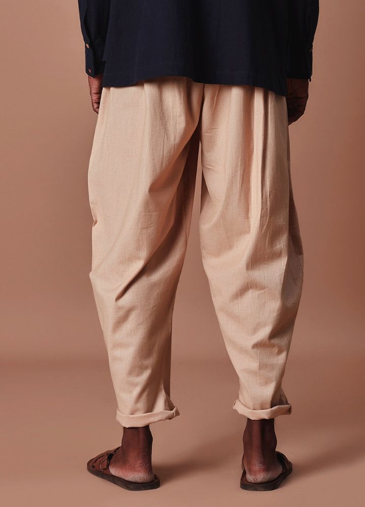 A Model Wearing  Beige Pure Cotton Men's Beige Pleated Balloon Pants, curated by Only Ethikal