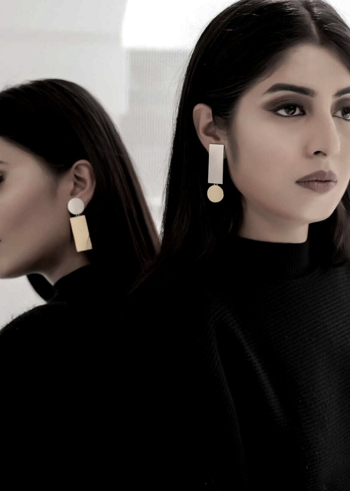 young woman wearing stylish earring from Opposites Attract collection curated by onlyethikal