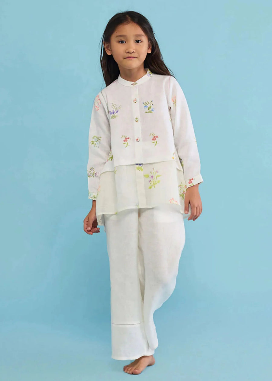A Model Wearing White Linen Kids Mapa Linen Culottes -White, curated by Only Ethikal