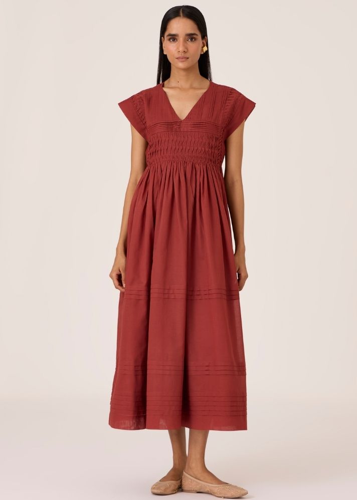 A Model Wearing Brown Organic Cotton Aelia Umber Pleated Midi Dress , curated by Only Ethikal