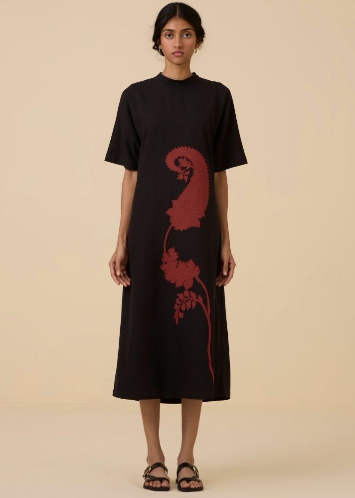 A Model Wearing Black Wool Cotton Ehan Black Hand Applique Dress , curated by Only Ethikal