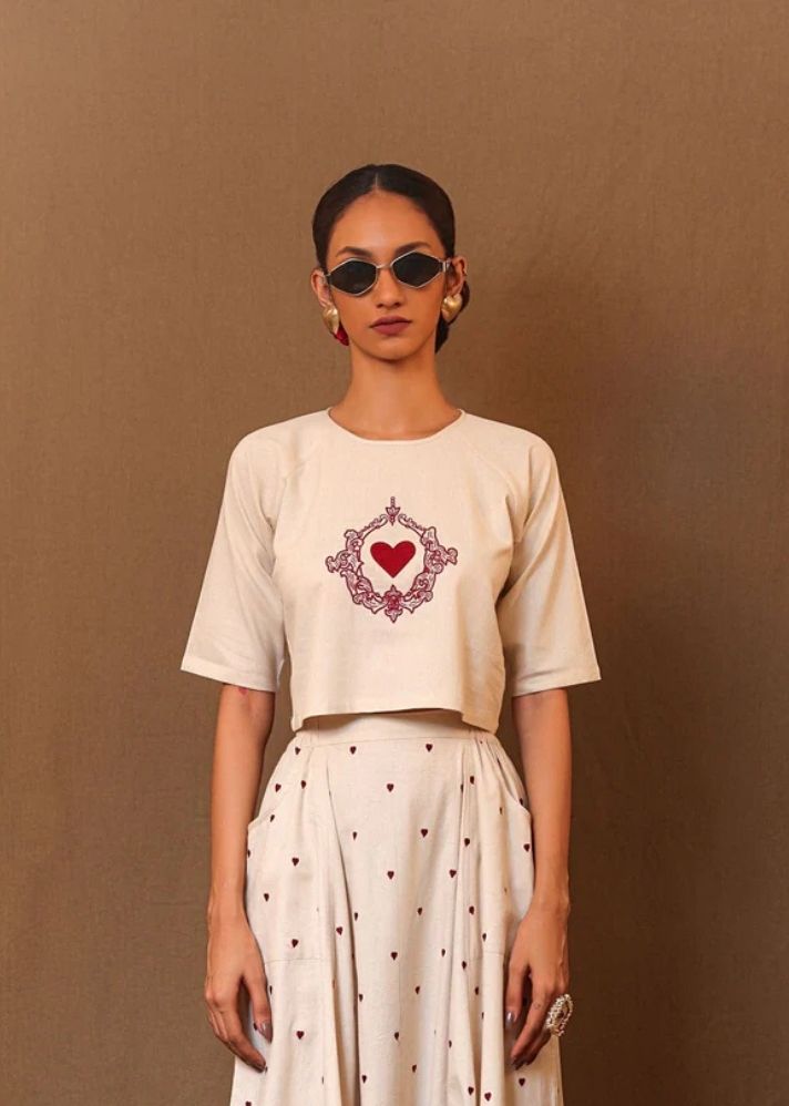 A Model Wearing White Pure Cotton Off-White Solo Emb Heart Top, curated by Only Ethikal