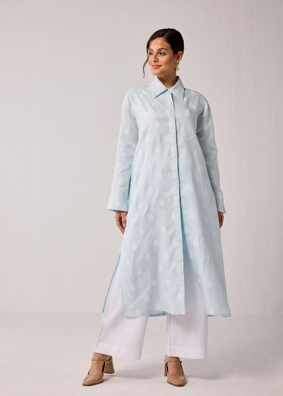A Model Wearing Blue Hemp Oversized Hemp Shirt Dress In Light Blue With White Embroidery, curated by Only Ethikal