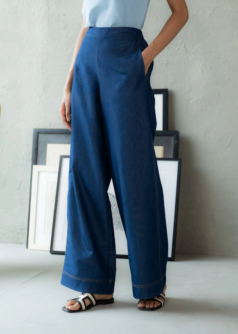 A Model Wearing Blue Denim Fluid Wayfarer Denim Pant, curated by Only Ethikal