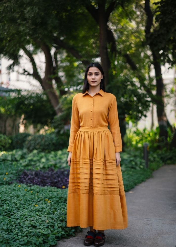 A Model Wearing Yellow Wool  Mustard Misha Skirt, curated by Only Ethikal