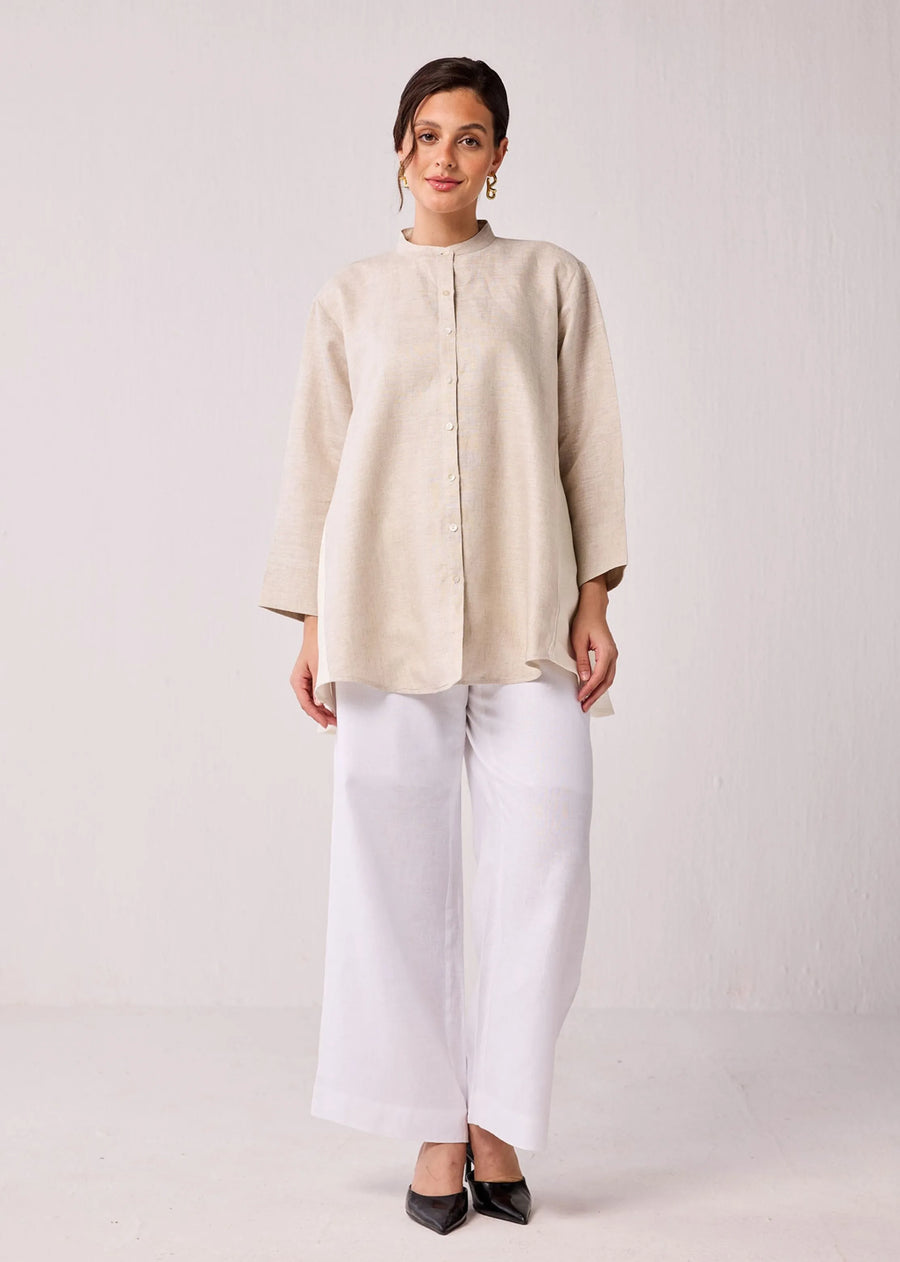 A Model Wearing Beige Hemp Oversized Long Hemp Shirt With Mandarin Collar In Beige, curated by Only Ethikal