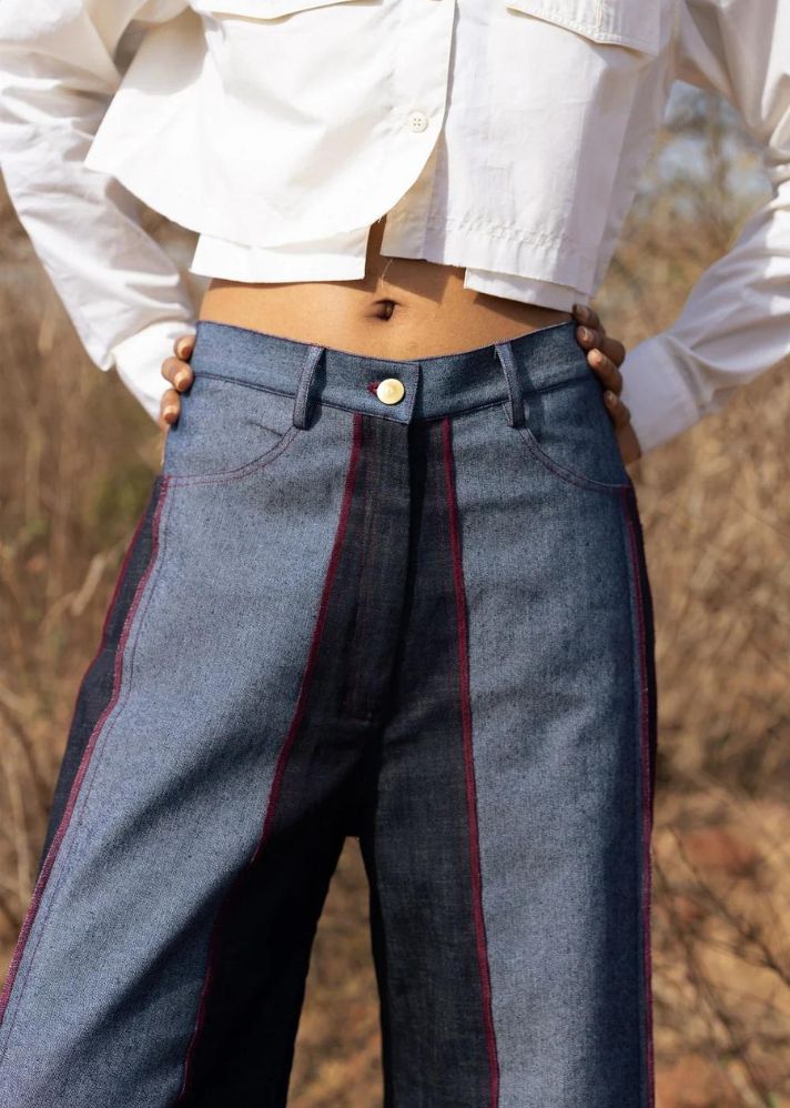 A Model Wearing Multicolor Upcycled Denim Steffie Flared Pants, curated by Only Ethikal