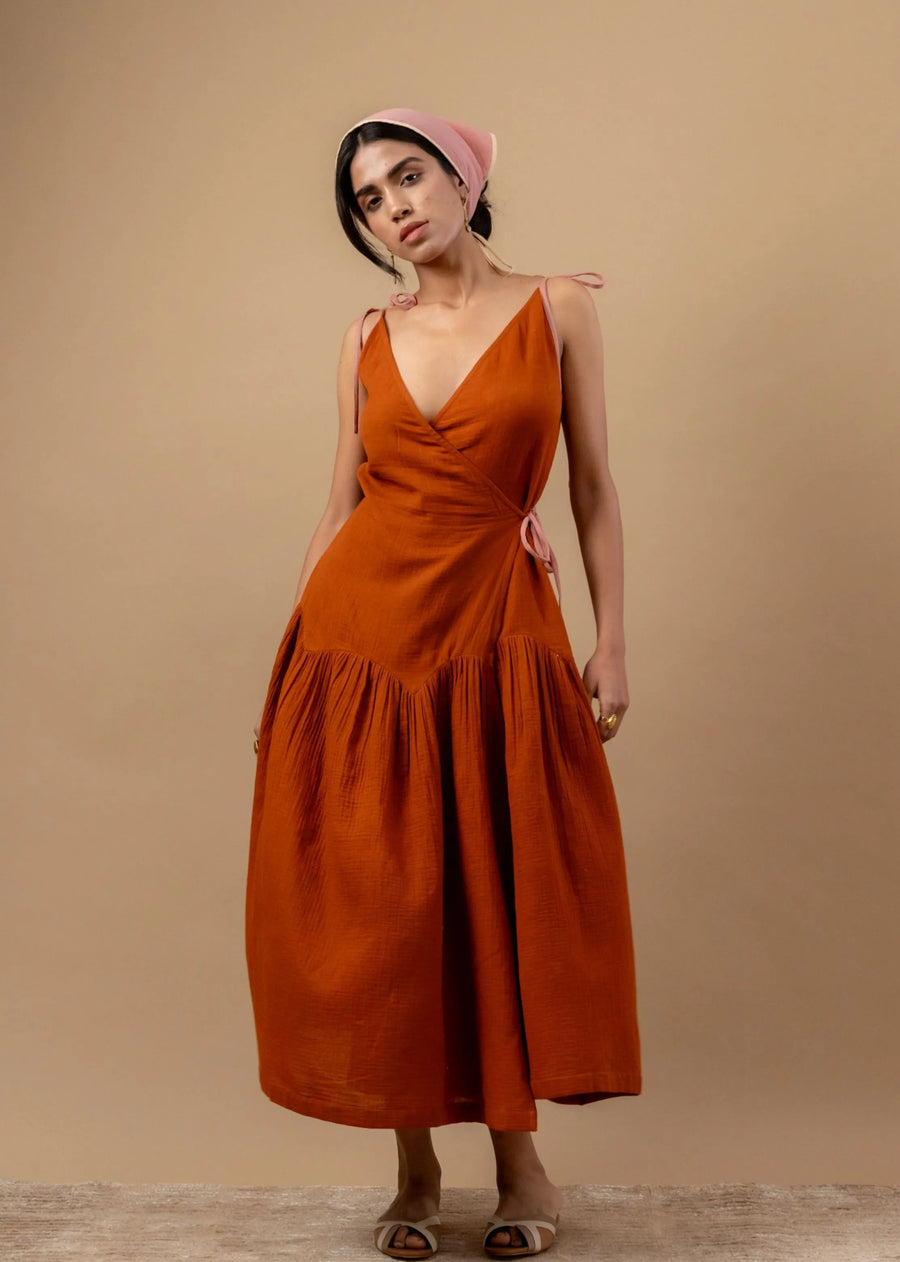 A Model Wearing Orange Organic Cotton Mudpie Maker Dress, curated by Only Ethikal