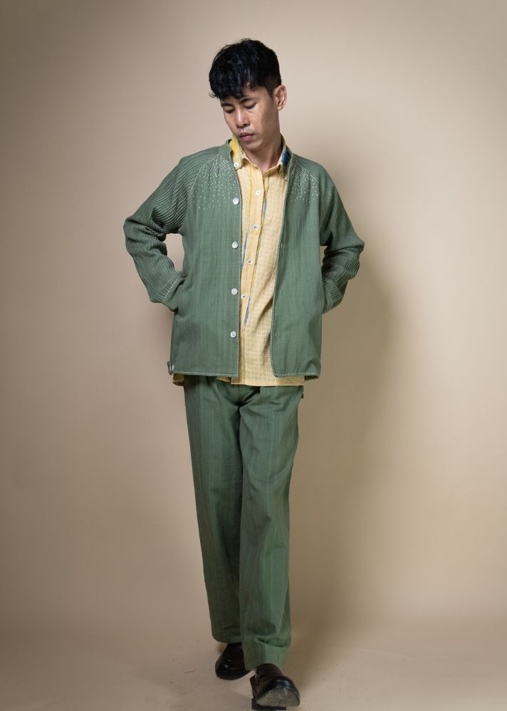 A Model Wearing Olive Pure Cotton Meadows Unisex Raglan Sleeve Jacket, curated by Only Ethikal