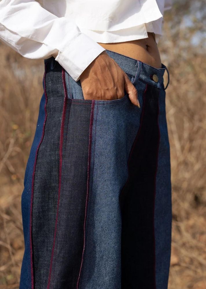A Model Wearing Multicolor Upcycled Denim Steffie Flared Pants, curated by Only Ethikal
