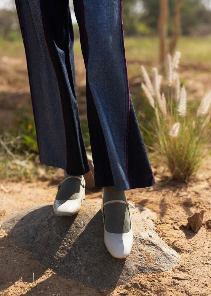 A Model Wearing Multicolor Upcycled Denim Steffie Flared Pants, curated by Only Ethikal