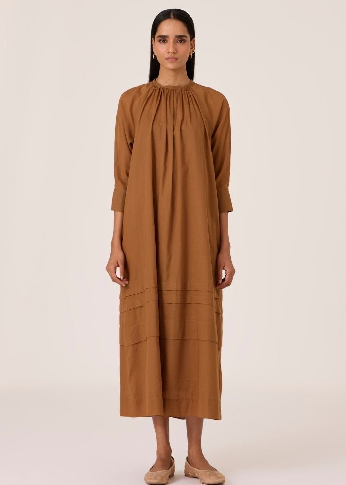 A Model Wearing Brown Organic Cotton Fares Brown Gathered Dress , curated by Only Ethikal