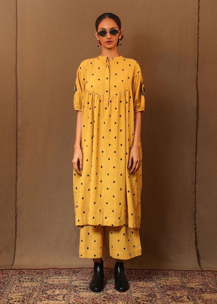 A Model Wearing Yellow Pure Cotton Mustard Spade Emb Re Pants, curated by Only Ethikal