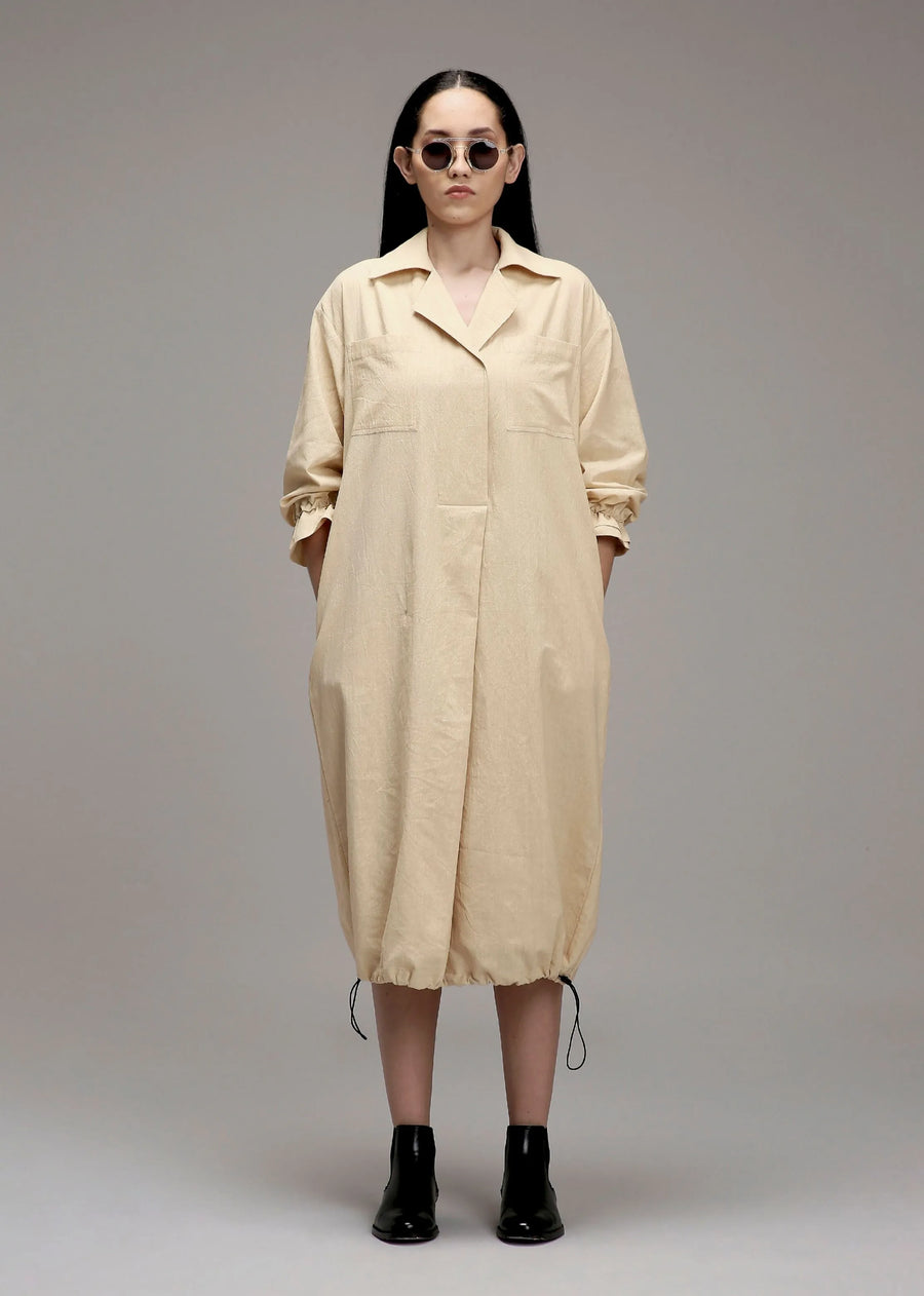 A Model Wearing Off White Cotton Egg-Shell Elasticated Shirt Dress, curated by Only Ethikal