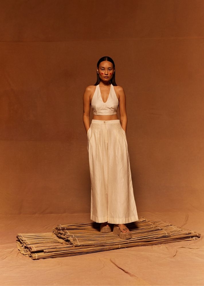 A Model Wearing White Cotton Silk Chanderi Shunkan Pleated Pants, curated by Only Ethikal