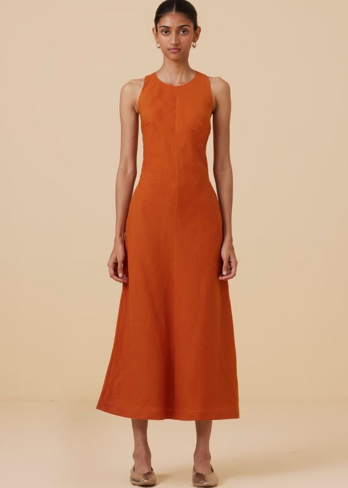 A Model Wearing Orange Linen Riha Orange Halter Maxi Dress , curated by Only Ethikal