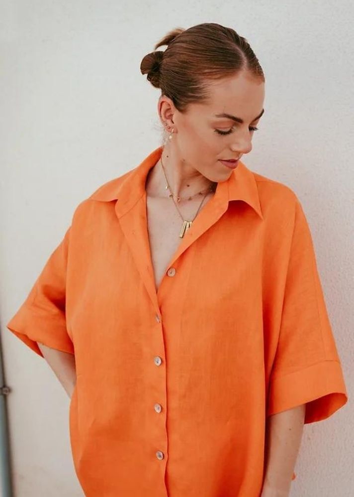 A Model Wearing Orange Linen Birds Of Paradise Shirt, curated by Only Ethikal