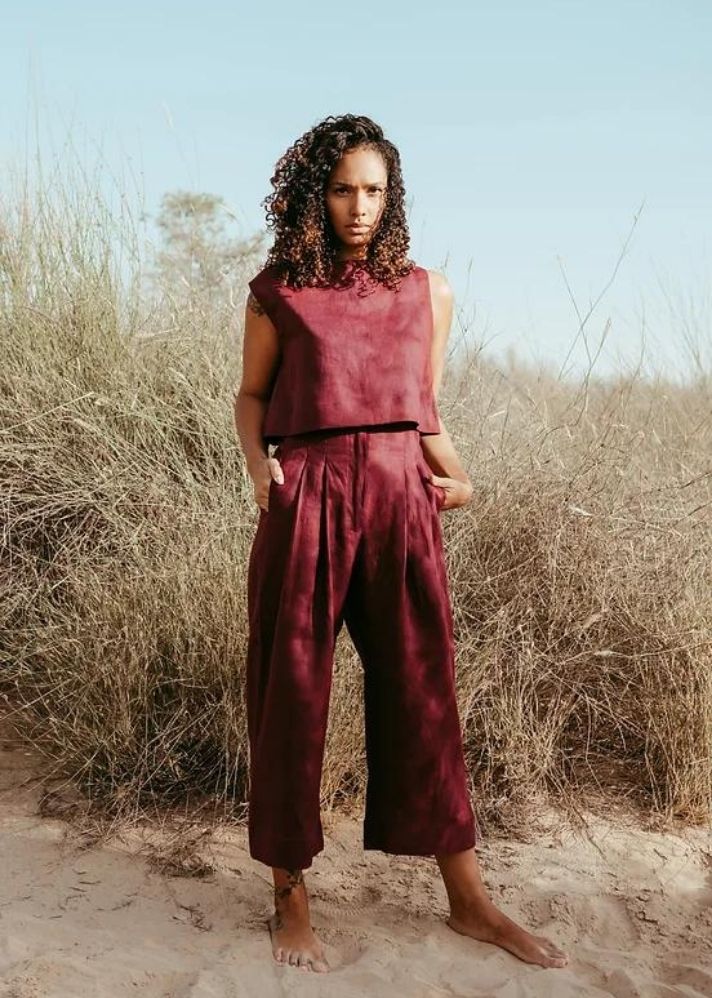 A Model Wearing Red Linen Amelia High Waisted Pants, curated by Only Ethikal