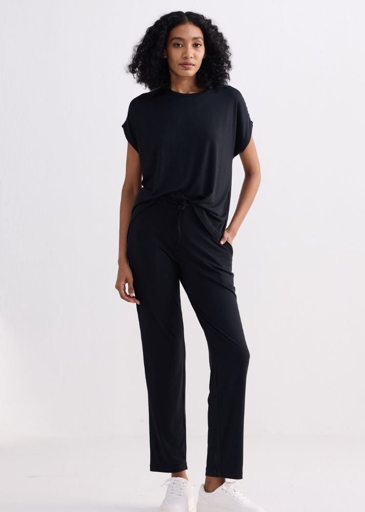 A Model Wearing Black Modal Relaxed Tee In Black, curated by Only Ethikal