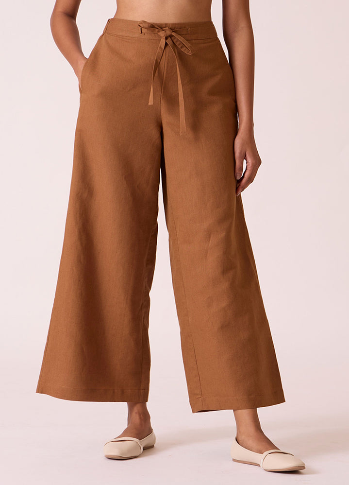 A Model Wearing Brown Linen Cotton Karnam Brown Linen Cotton Trousers , curated by Only Ethikal