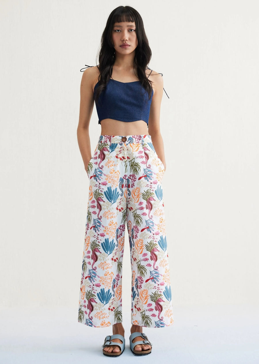 A Model Wearing White Organic Cotton The Seahorse Organic Cotton White Trousers, curated by Only Ethikal