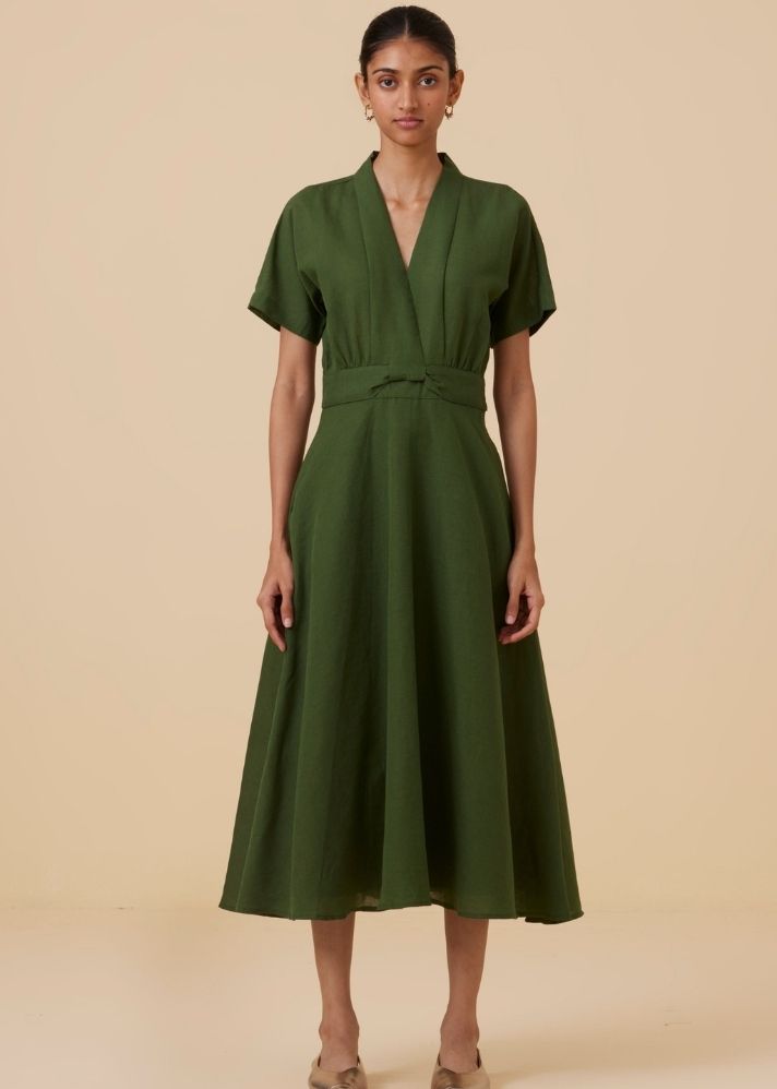 A Model Wearing Green Linen Miyake Green Midi Dress , curated by Only Ethikal