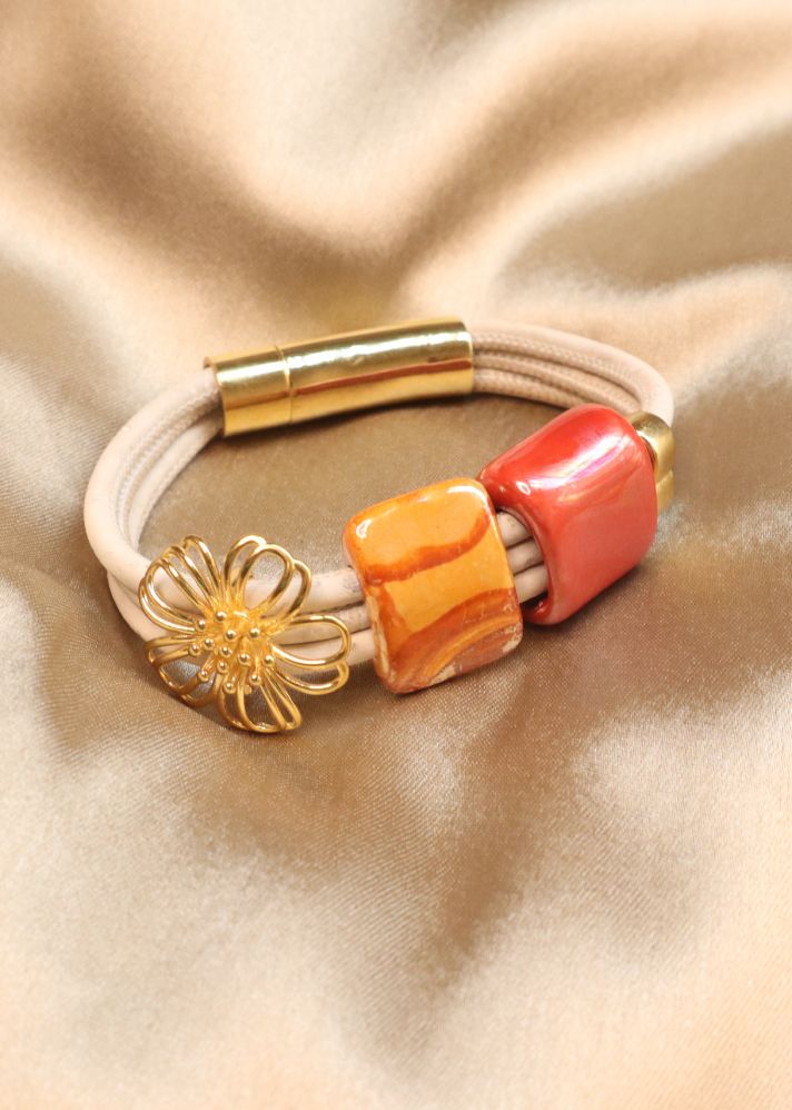 A Model Wearing White Cork Flower And Light Bracelet In Cork & Ceramic, curated by Only Ethikal