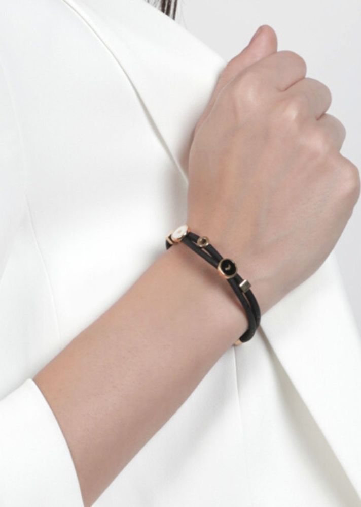 A Model Wearing Black Cork Moon And Heart Bracelet, curated by Only Ethikal