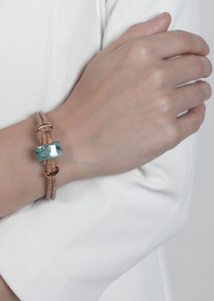 A Model Wearing Multicolor Cork Nothern Light Vegan Bracelet In Cork And Ceramic Beads- Gold, curated by Only Ethikal