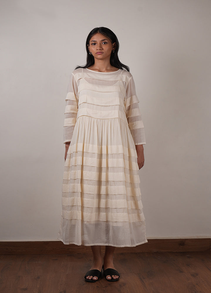 A Model Wearing Off White Organic Cotton Mati Pleated Dress, curated by Only Ethikal