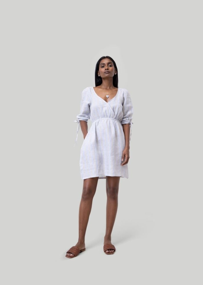 A Model Wearing White Linen Gathered Elbow Sleeve Short Dress White, curated by Only Ethikal