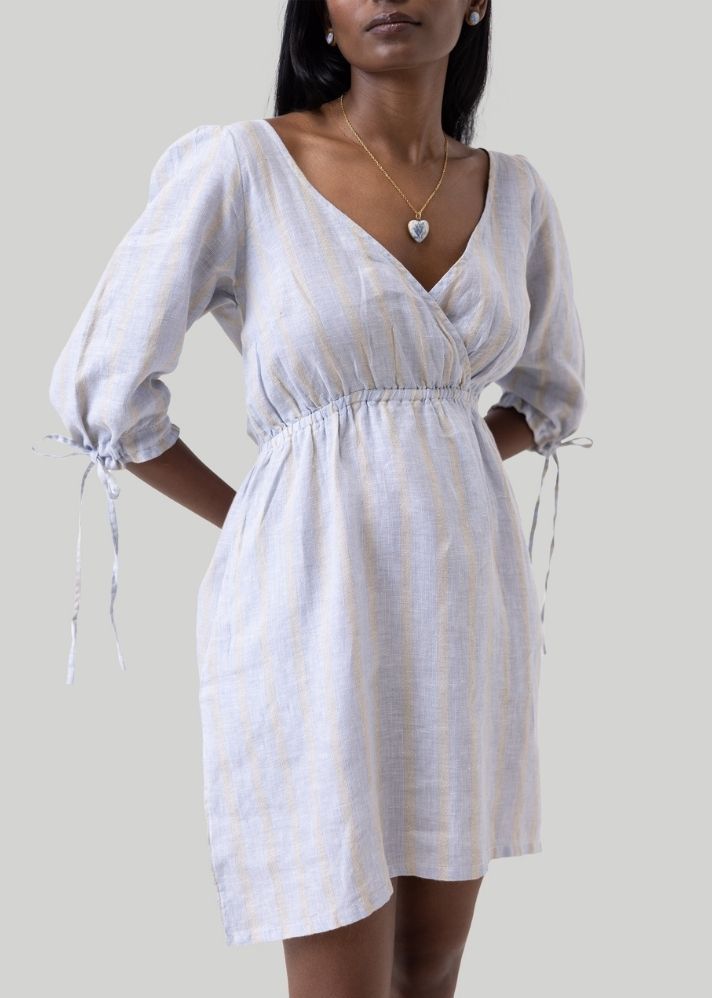 A Model Wearing White Linen Gathered Elbow Sleeve Short Dress White, curated by Only Ethikal