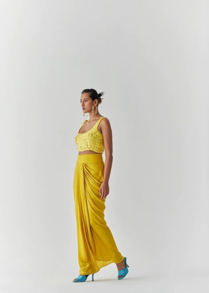 A Model Wearing Yellow Organic Cupro Canary Sequin Blouse & Knot Skirt, curated by Only Ethikal