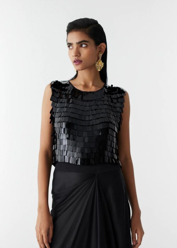 A Model Wearing Black Organic Cupro Toucan Sequin Blouse & Knot Skirt , curated by Only Ethikal