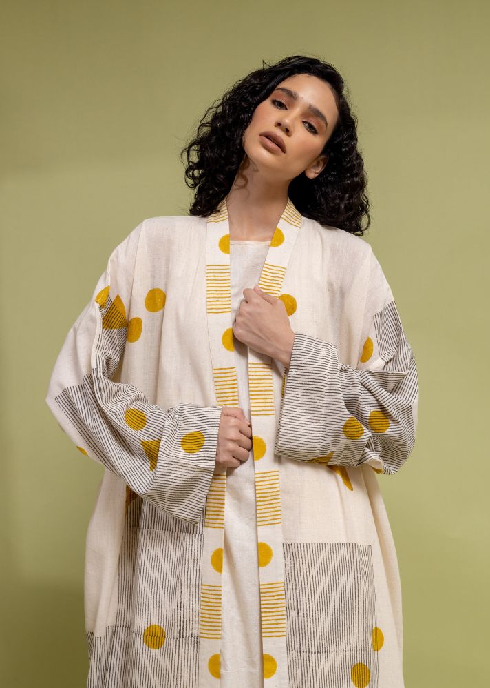 A Model Wearing White Handwoven Cotton Linear Off White Abaya, curated by Only Ethikal