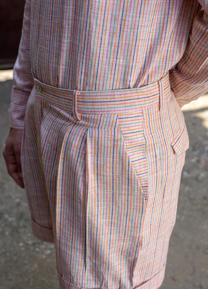 A model wearing Striped Multicolor Handwoven Cotton Double Knife Pleat Bermudas, curated by Only Ethikal