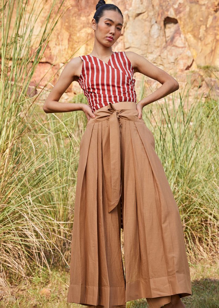 A Model Wearing Brown Pure Cotton Lost In Chase Pleated Trouser, curated by Only Ethikal