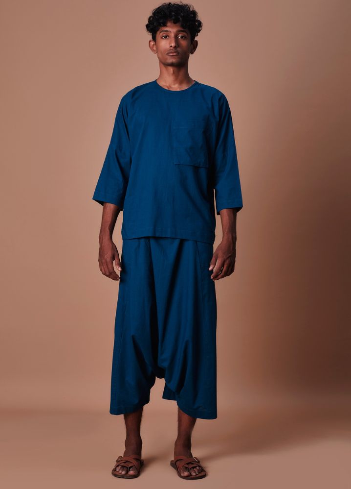 A Model Wearing  Blue Pure Cotton Teal Blue Cross Pocket T-Shirt & Harem Pants Set, curated by Only Ethikal