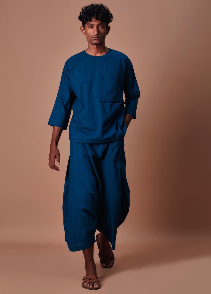 A Model Wearing  Blue Pure Cotton Teal Blue Cross Pocket T-Shirt & Harem Pants Set, curated by Only Ethikal