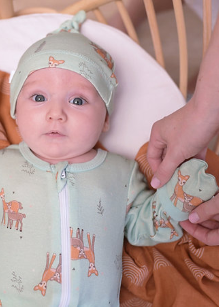 A Model Wearing Blue Organic Cotton Dasher Organic Newborn Mittens , curated by Only Ethikal