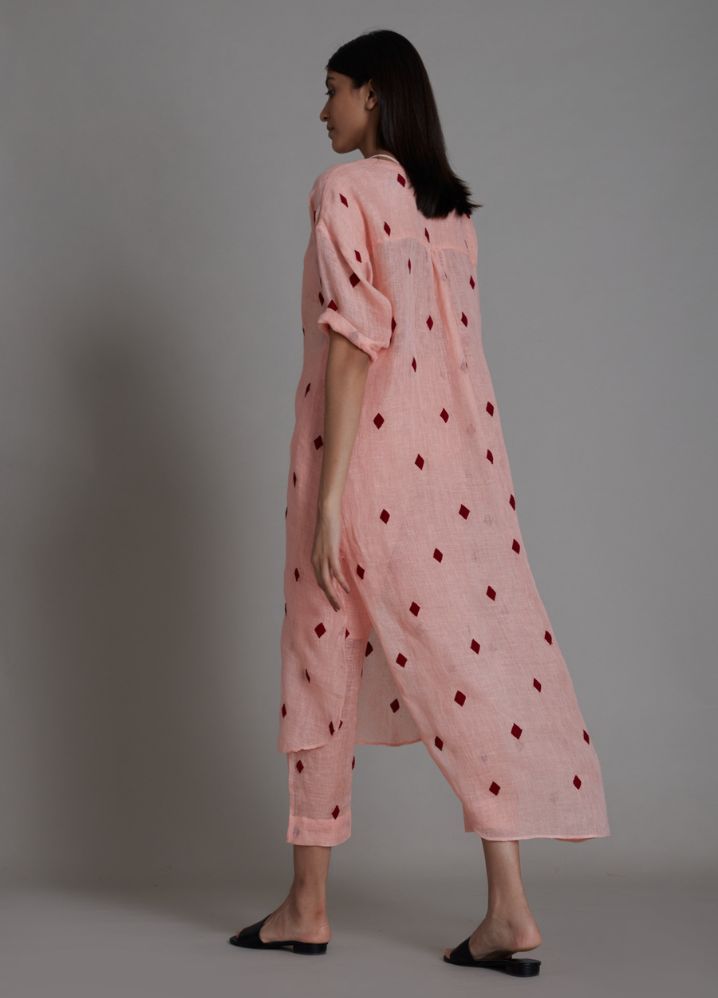 A Model Wearing Peach Linen Se Trump Card Pants - Pink, curated by Only Ethikal