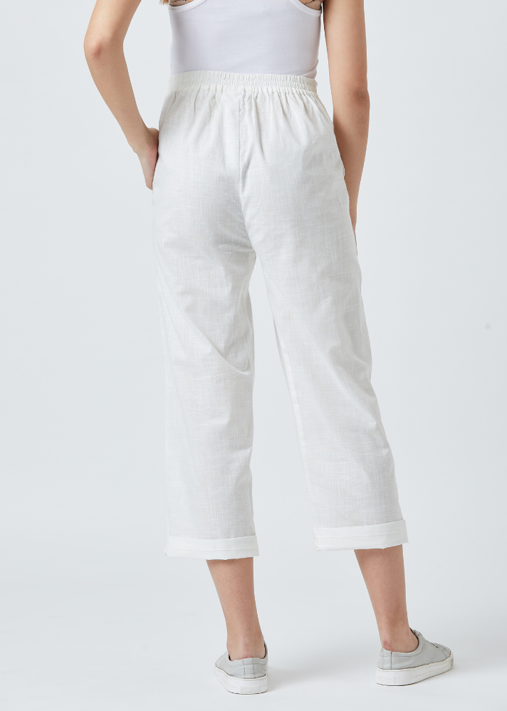 Women wearing pure Cotton Tapered White pants by Doodlage curated by Only ethikal 