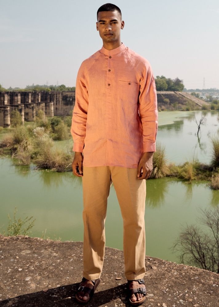 A Model Wearing Pink Linen Coral Crane Shirt, curated by Only Ethikal