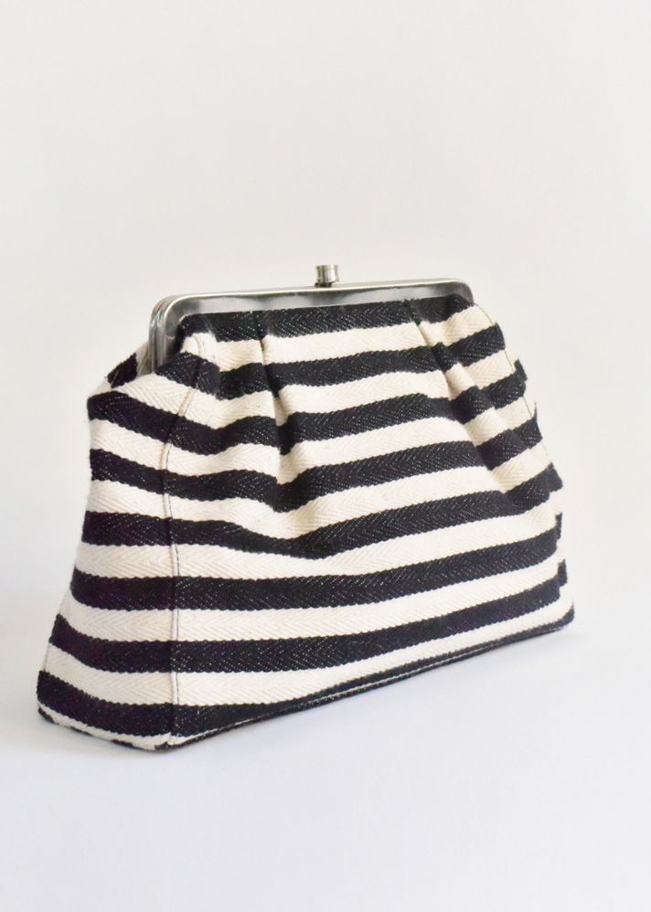 A Model Wearing Black Handwoven Cotton Stripe It Black Clutch, curated by Only Ethikal