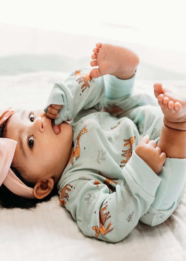 A Model Wearing Mint Organic Cotton Dasher Zipup Organic Sleepsuit, curated by Only Ethikal