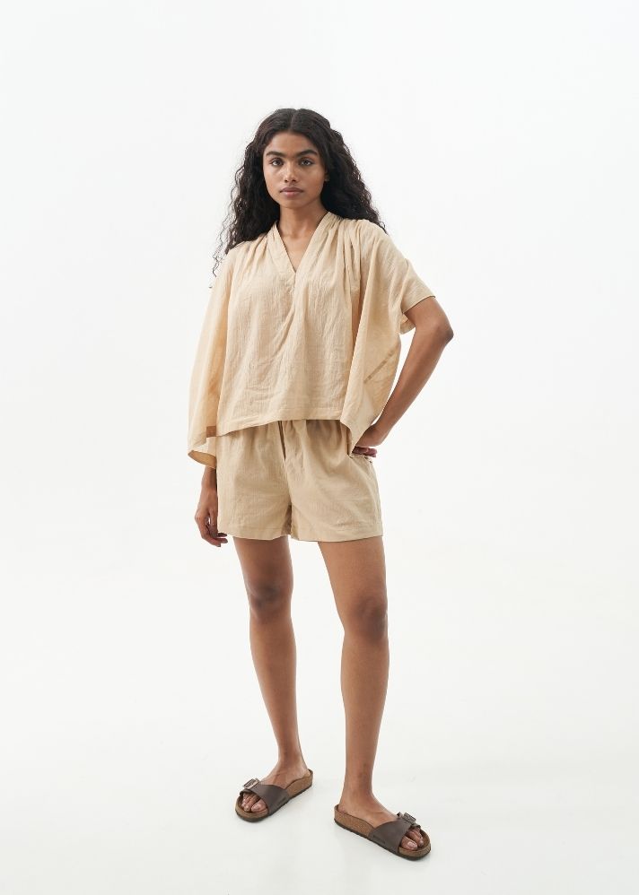 A Model Wearing Beige Handwoven Cotton Sand shorts set, curated by Only Ethikal